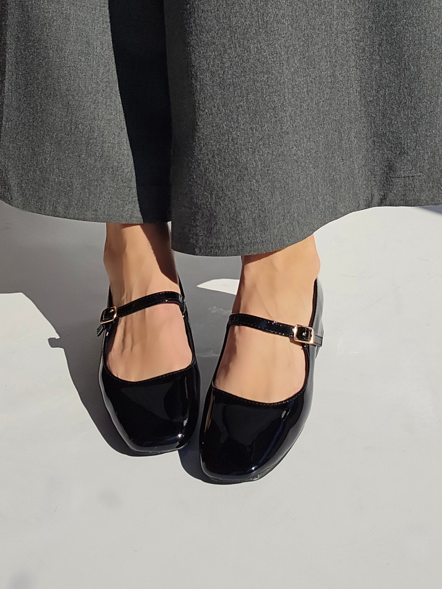 Black patent Mary Jane pumps