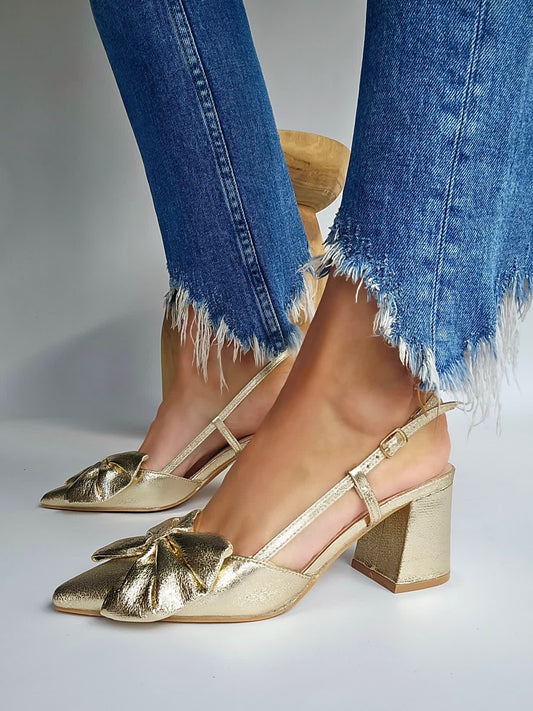Pointed toe pumps with gold bows